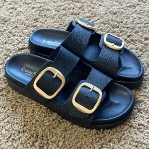 Black leather with gold buckle sandals